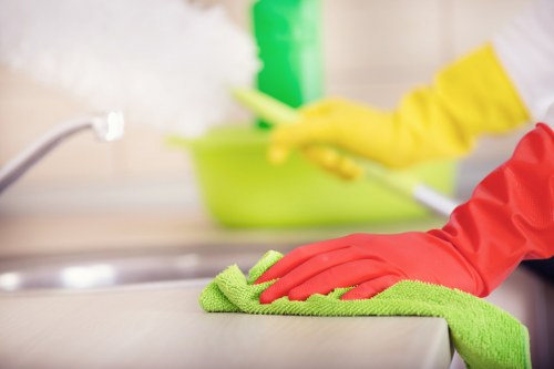Cleaner reviewing safety procedures during routine work